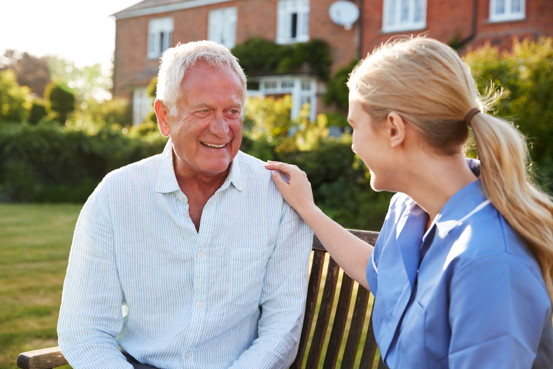 nurse talking to senior man in residential care ho P28XMPC